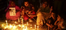 Families hold a vigil for those killed at Rana Plaza